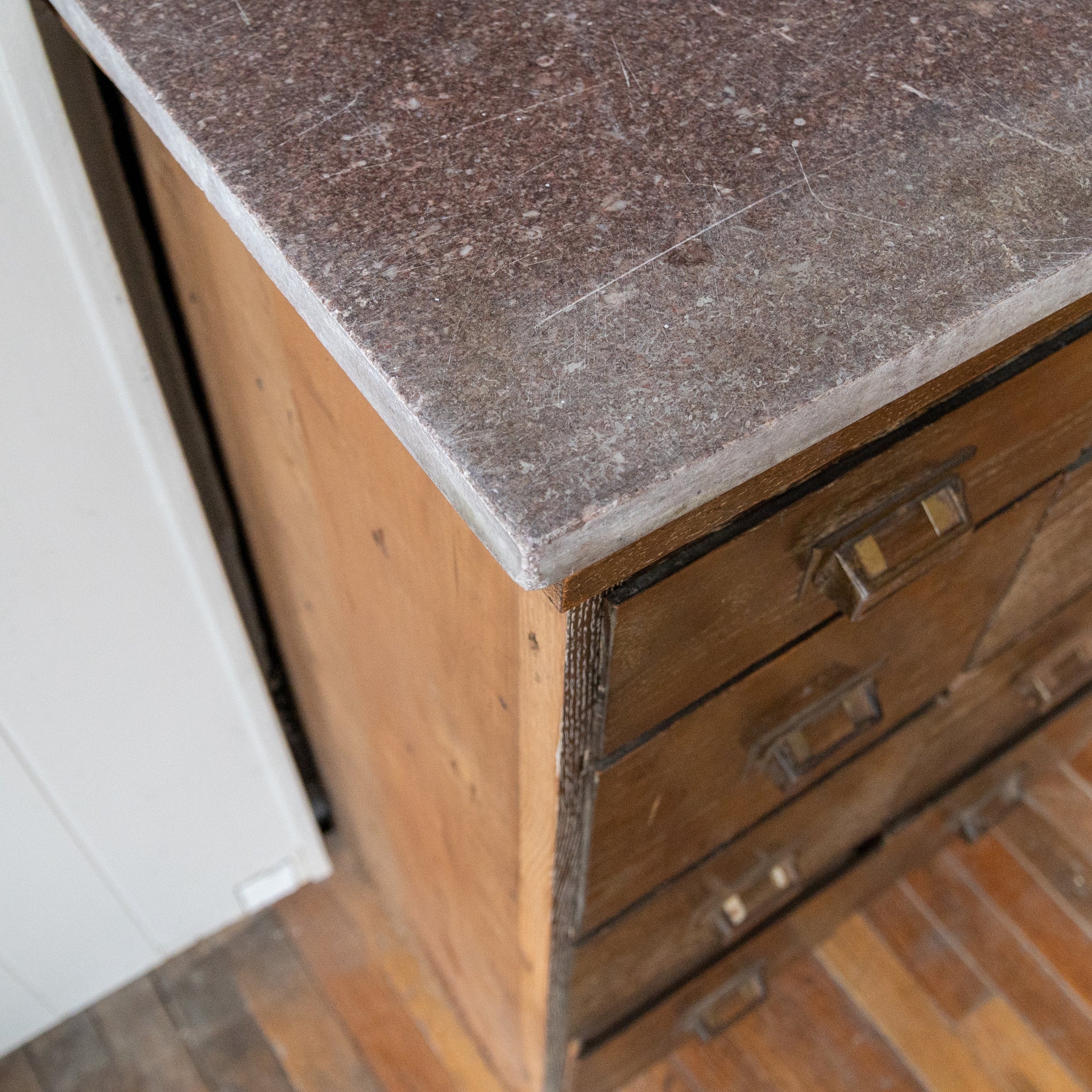 reclaimed apothecary cabinet oak red marble close up view