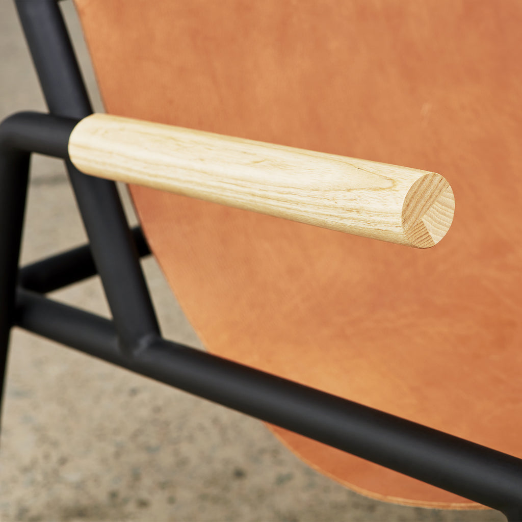 Wyatt sling chair sorrel Havana leather arm detail view